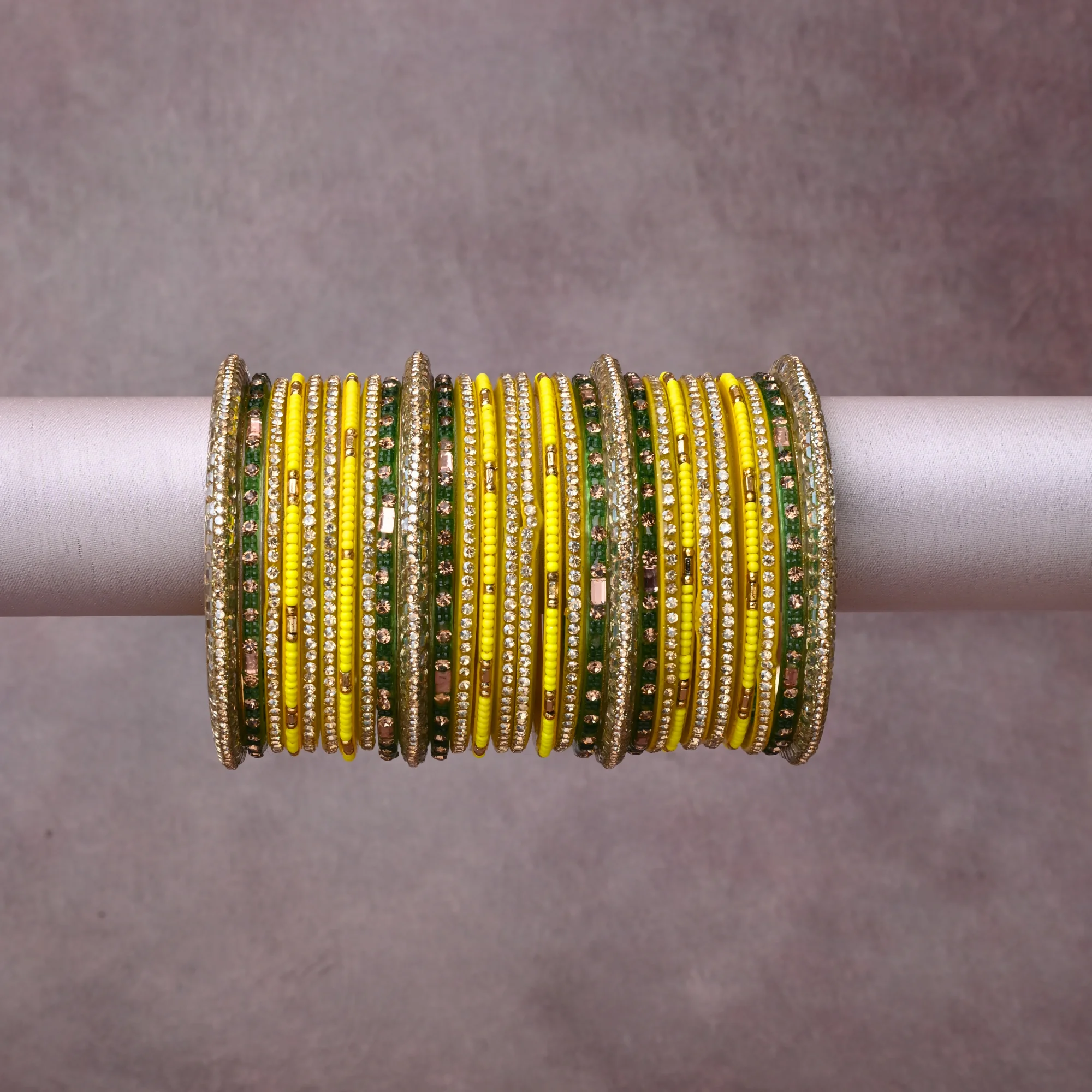 A grounding Vibrant Yellow forms the heart of the set, while touches of  add charm.

A thoughtful composition of Gold-toned Metal, Resin, Glass Seed Beads, Clear Faceted Crystals, designed to feel complete without being heavy.
Each element layers seamlessly, creating a look that is refined, wearable and quietly striking.